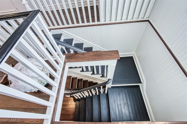 stairway with wooden walls