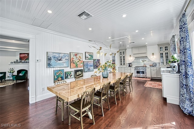 dining room with wood ceiling, dark hardwood / wood-style floors, and crown molding