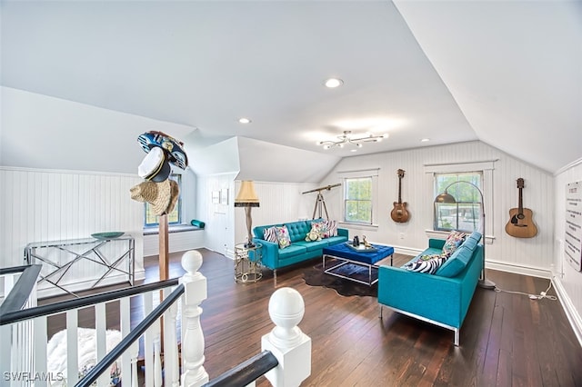 living room with dark hardwood / wood-style flooring and vaulted ceiling