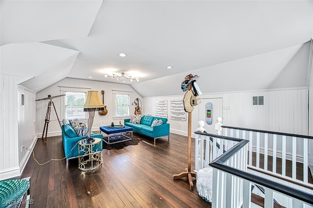 living area with vaulted ceiling and dark hardwood / wood-style floors