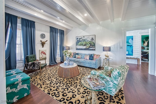 living room with beamed ceiling and dark hardwood / wood-style floors