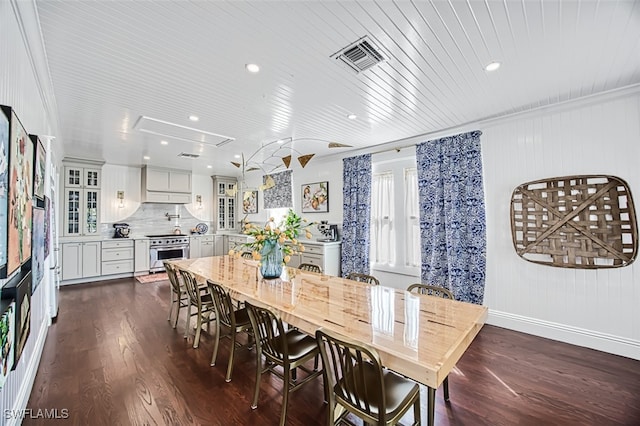 dining area featuring ornamental molding, wooden ceiling, and dark hardwood / wood-style flooring