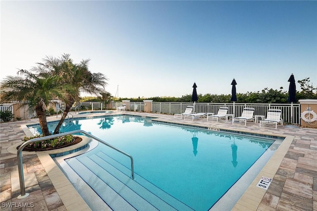 view of swimming pool featuring a patio area