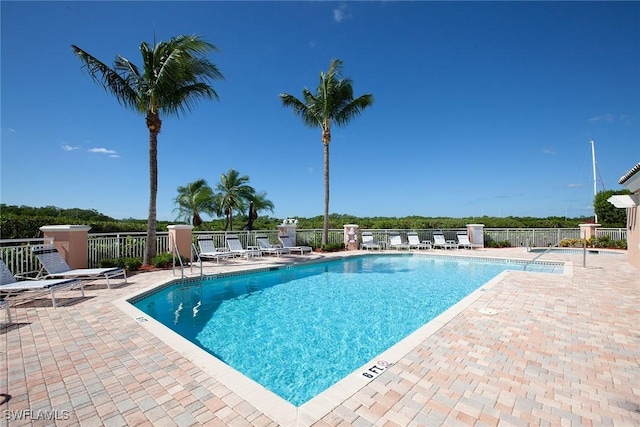 view of swimming pool with a patio