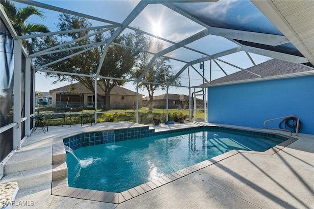 view of pool featuring a patio, a lanai, and pool water feature