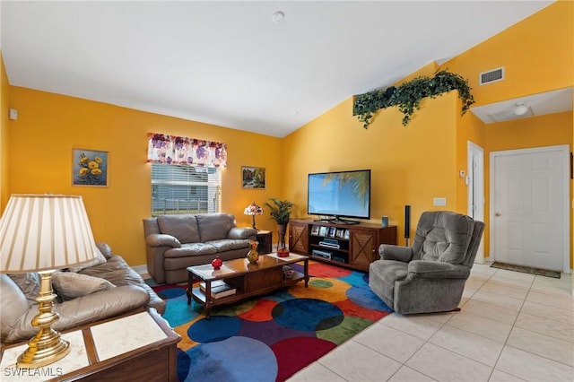 living room with vaulted ceiling and light tile patterned flooring