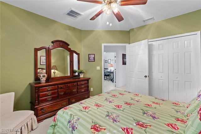 bedroom featuring ceiling fan and a closet