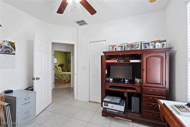 home office with light tile patterned flooring and ceiling fan