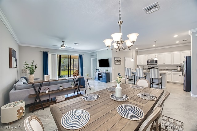 dining space with ceiling fan with notable chandelier and ornamental molding