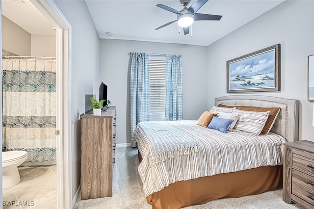 bedroom with ceiling fan and connected bathroom