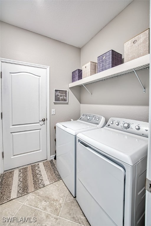 laundry area with washing machine and clothes dryer