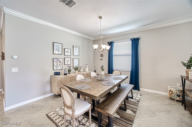 tiled dining room with a textured ceiling, crown molding, and a notable chandelier