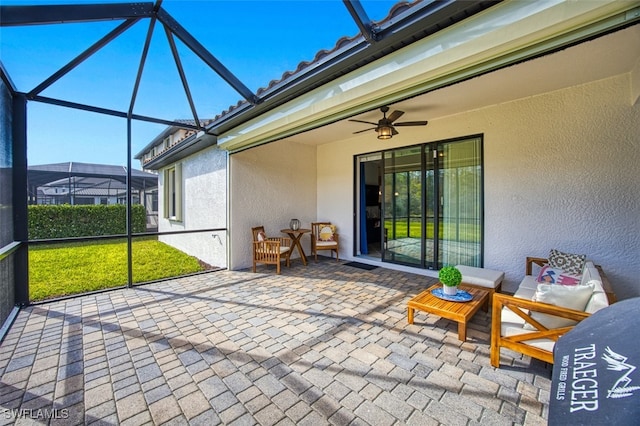 sunroom featuring ceiling fan