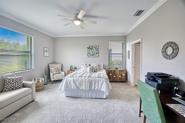 carpeted bedroom featuring ceiling fan and ornamental molding