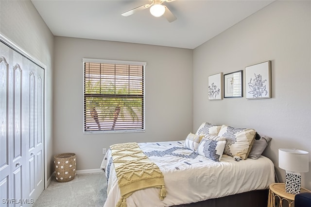 bedroom featuring ceiling fan, a closet, and carpet flooring