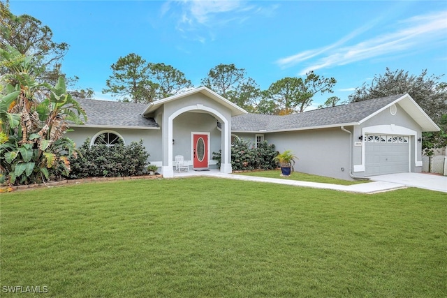 ranch-style house featuring a front yard and a garage