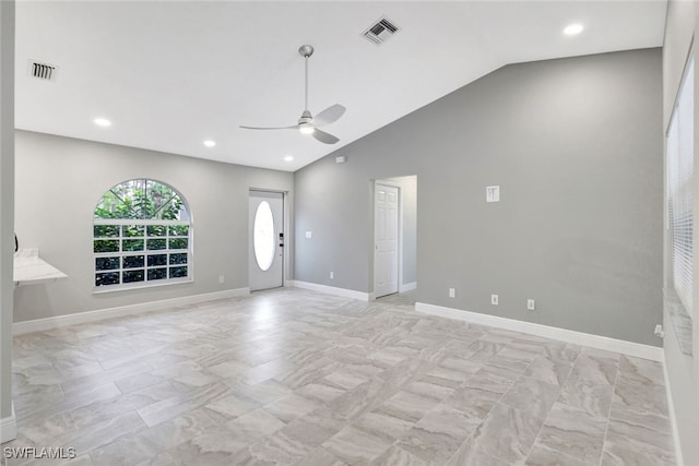 interior space with ceiling fan and vaulted ceiling