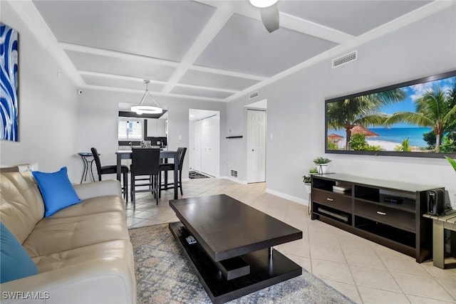 living room with ceiling fan, light tile patterned flooring, and coffered ceiling