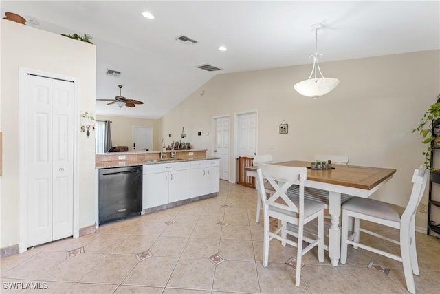 kitchen featuring ceiling fan, sink, dishwasher, white cabinetry, and hanging light fixtures