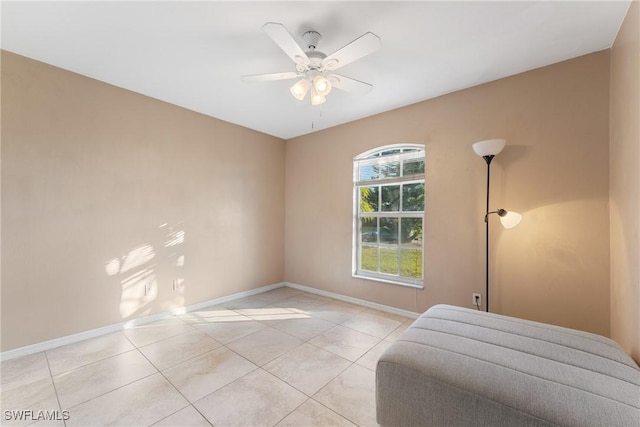 tiled bedroom featuring ceiling fan