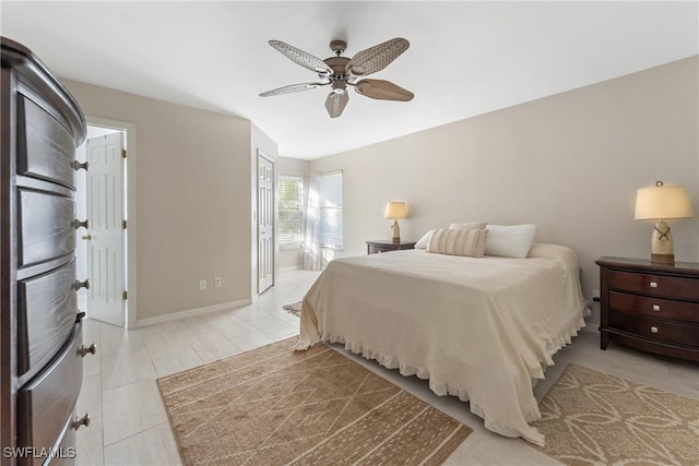 bedroom with connected bathroom and ceiling fan