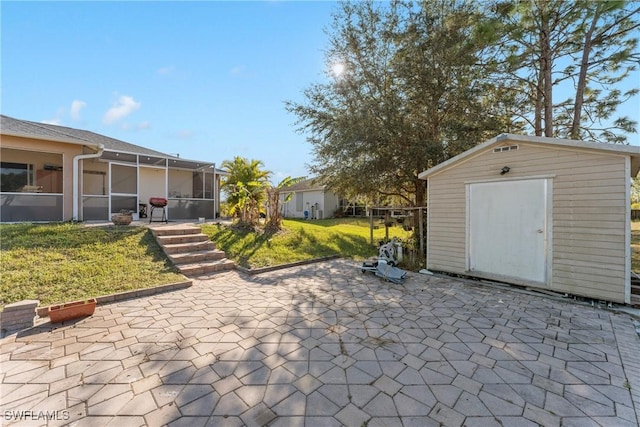 view of patio featuring a storage unit and a lanai