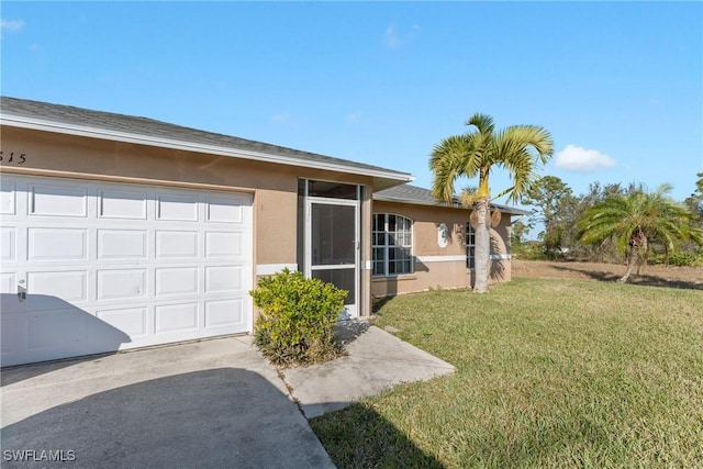 view of front facade with a garage and a front lawn