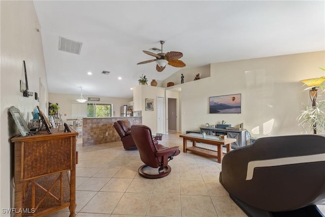 tiled living room featuring ceiling fan and lofted ceiling