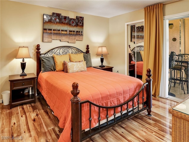 bedroom with hardwood / wood-style flooring