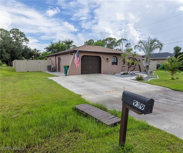 ranch-style home with a garage, central air condition unit, and a front lawn