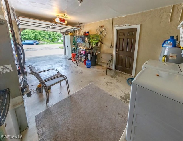 garage featuring separate washer and dryer and a garage door opener