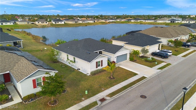 aerial view with a residential view and a water view