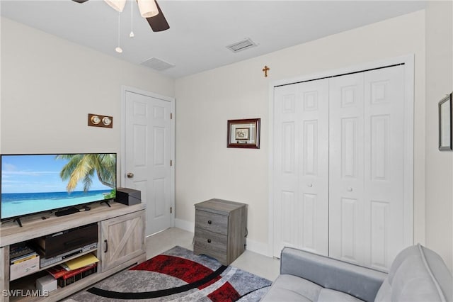 living room featuring ceiling fan