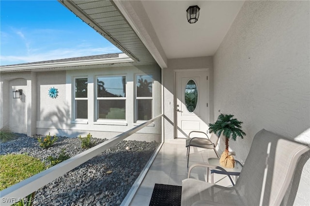 entrance to property featuring a balcony