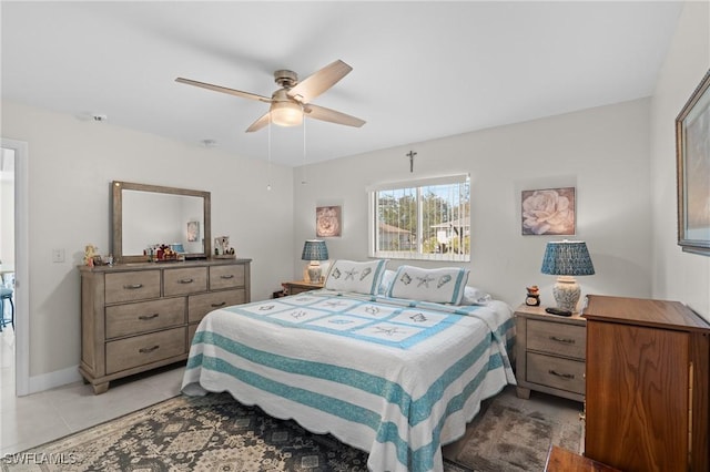 bedroom with ceiling fan and light tile patterned floors