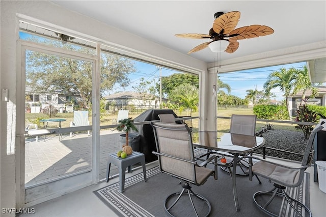 sunroom featuring ceiling fan