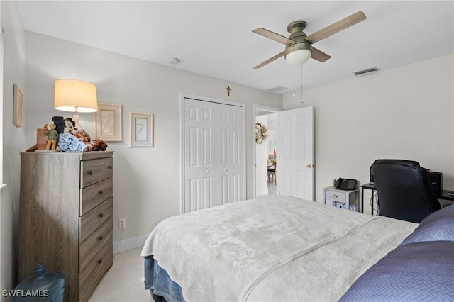 carpeted bedroom with a closet and ceiling fan