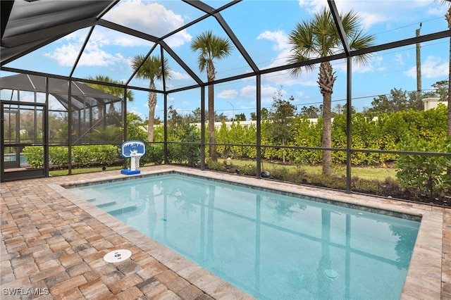 outdoor pool featuring a lanai and a patio