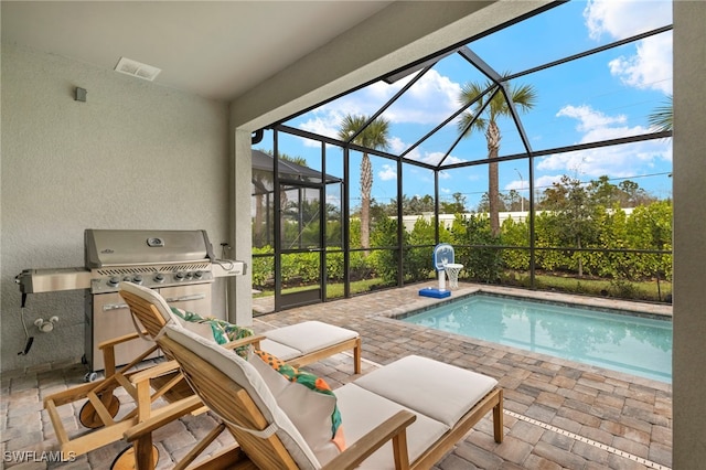 outdoor pool with a lanai, a patio, and area for grilling