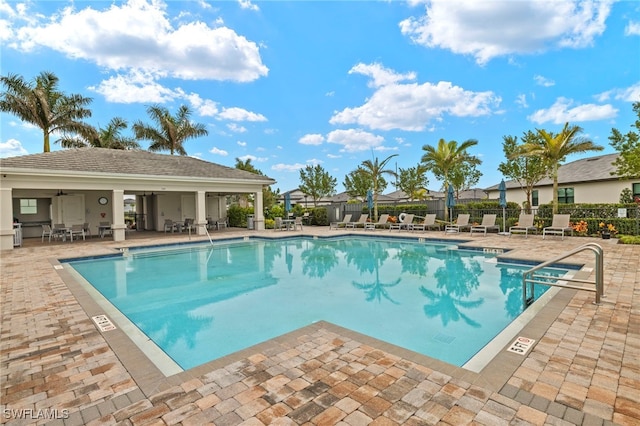 pool featuring a patio and fence