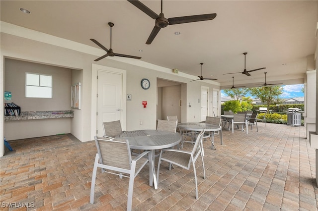 view of patio / terrace featuring outdoor dining area and ceiling fan