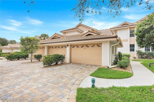 front facade with a garage