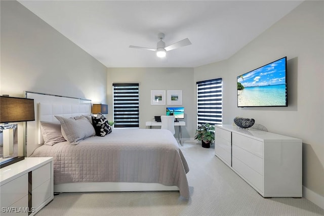 bedroom with ceiling fan and light colored carpet