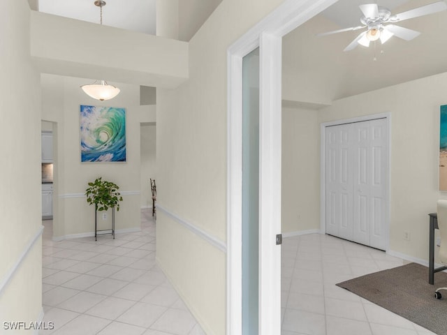 hallway featuring light tile patterned floors