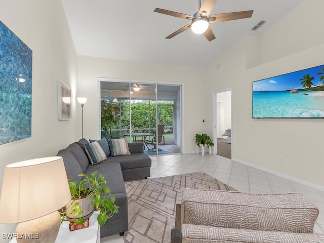 living room with ceiling fan, high vaulted ceiling, and light tile patterned floors