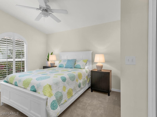 bedroom featuring light carpet and ceiling fan