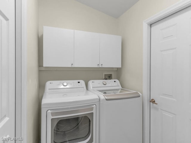 laundry area featuring cabinets and independent washer and dryer