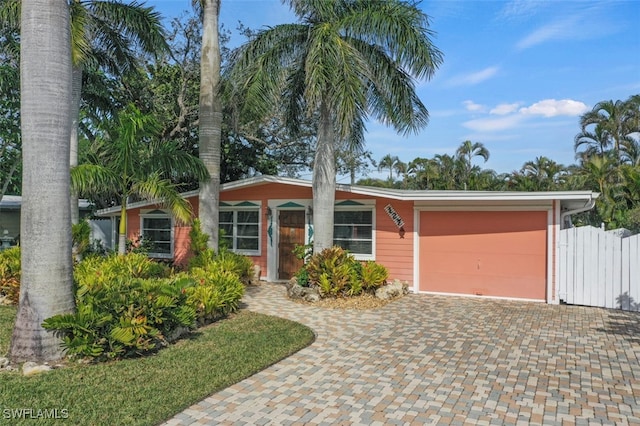 ranch-style house featuring a garage