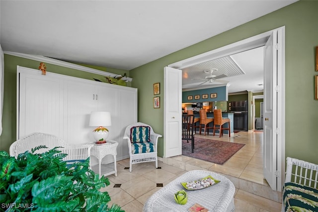 interior space with ceiling fan and light tile patterned floors