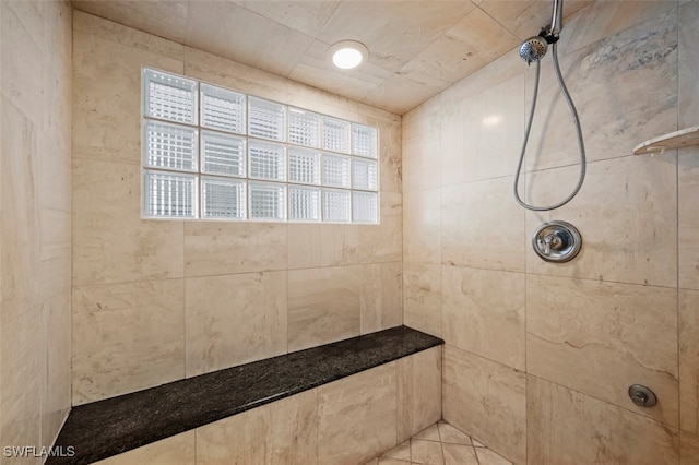 bathroom featuring tiled shower